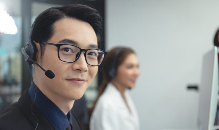 call center agent team, customer service support wearing headset or headphone talking with customer